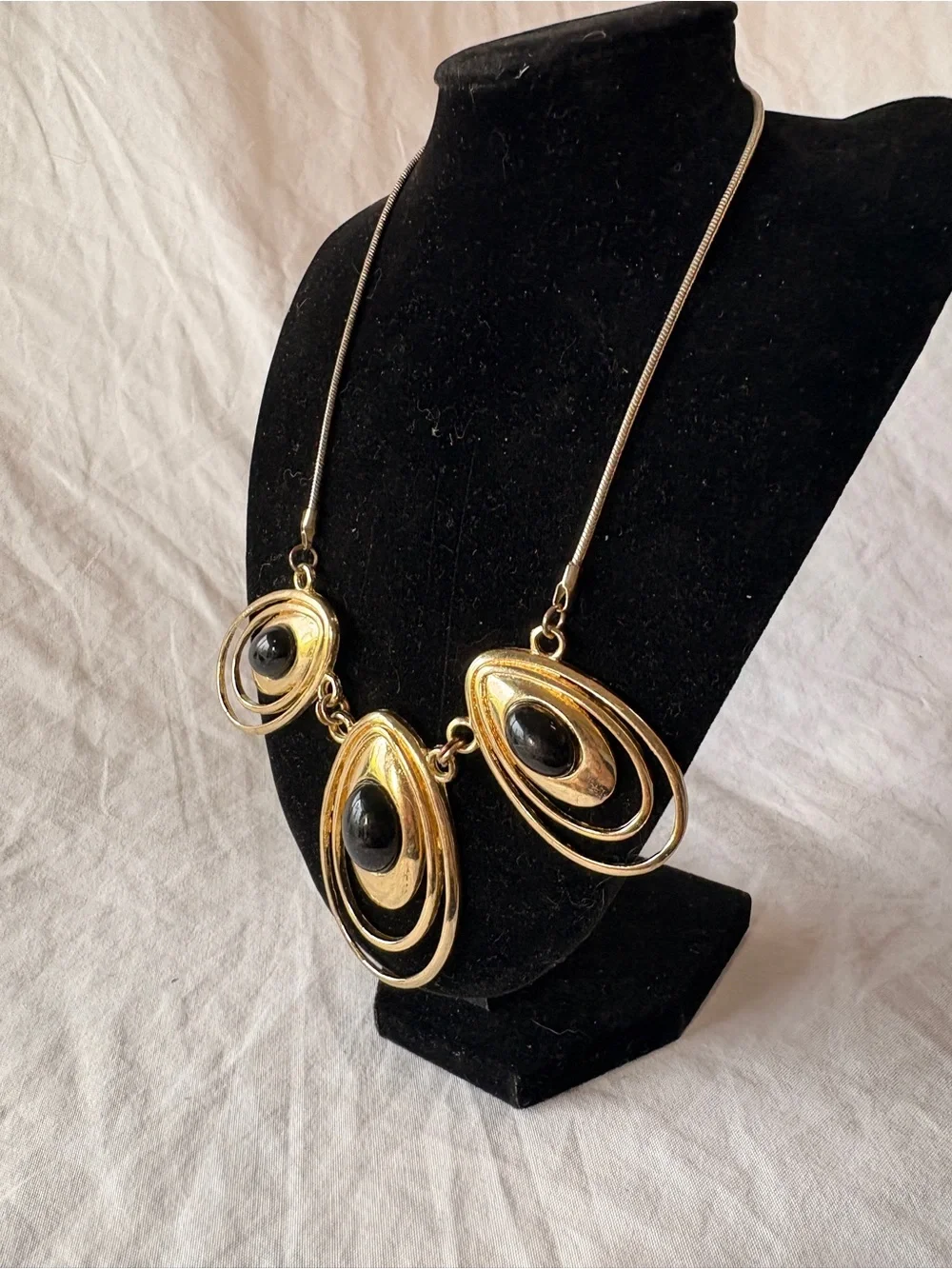 Gold-tone Statement Necklace with Black Cabochon Accents